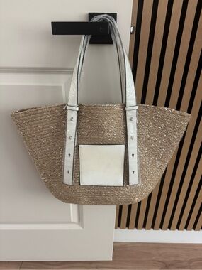Beige Straw Tote with White Trim and Front Pocket